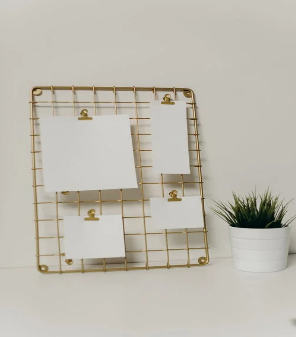 Memo board with cards clipped to it